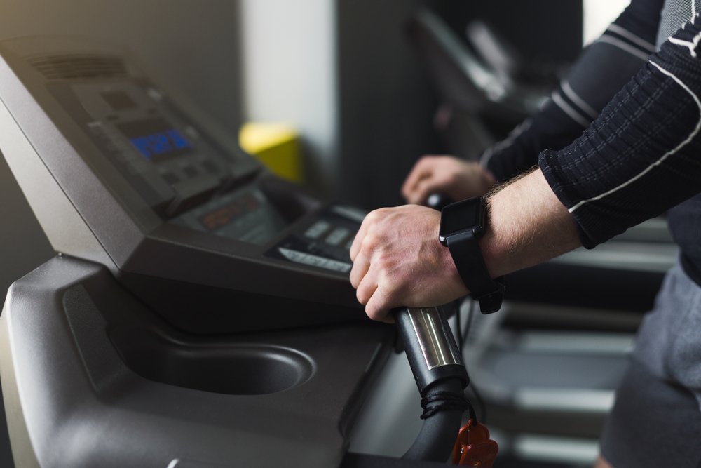 Why You Should Stop Holding Onto The Handrails On The Treadmill